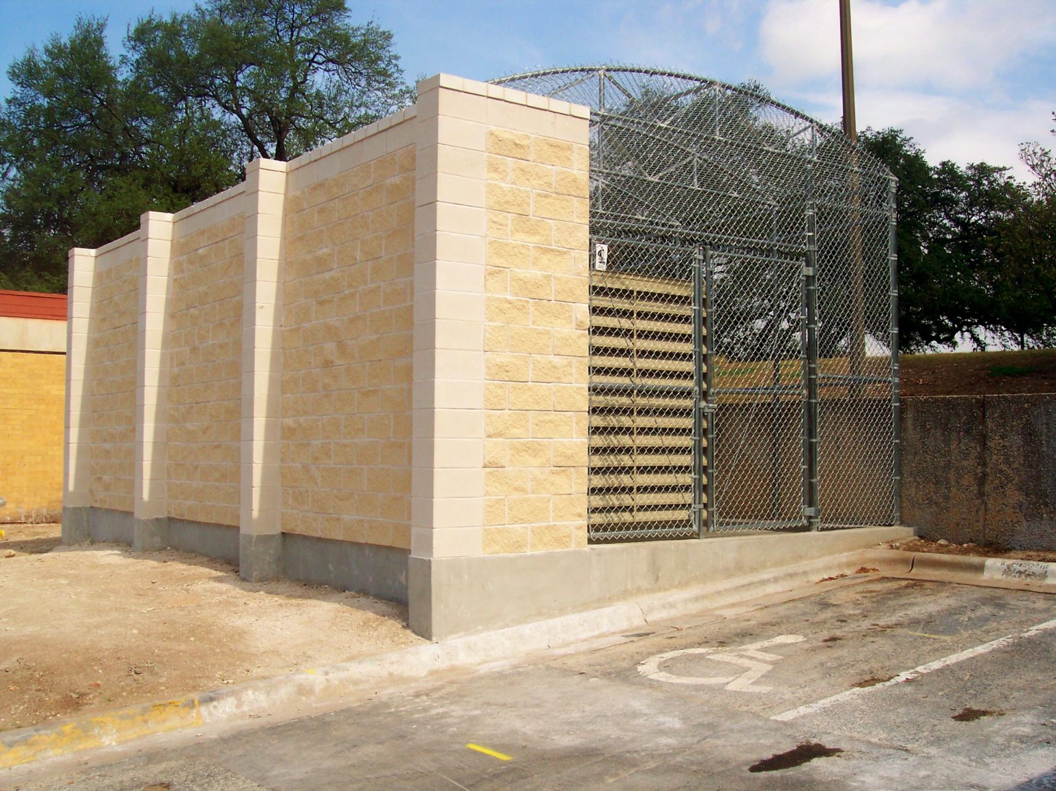 Chain Link Enclosure with Brick Wall Viking Fence
