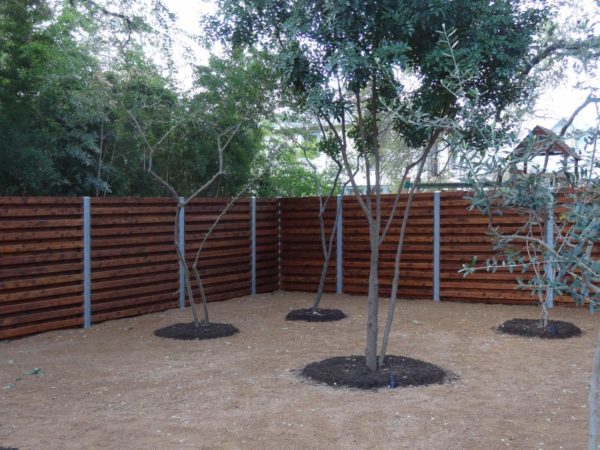 Custom Stained Wood Fence with Steel Accents - Image 6