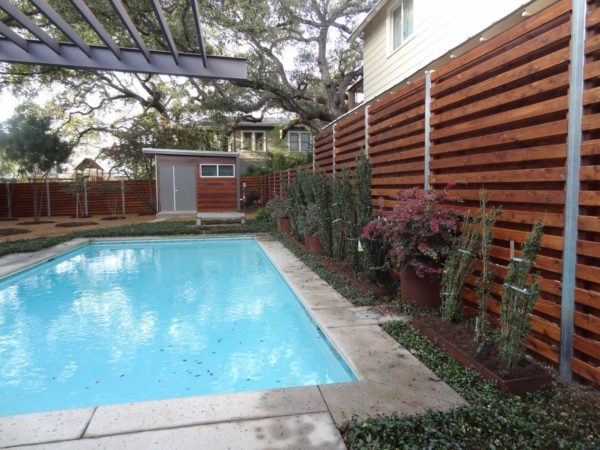 Custom Stained Wood Fence with Steel Accents - Image 3